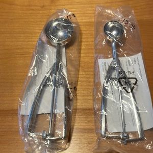 New in original packaging. Large and small scoop. Price is for both scoops.